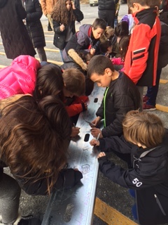 Kids signing the bench