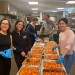 Volunteers at WRT Cook Thanksgiving Dinners for Those in Need